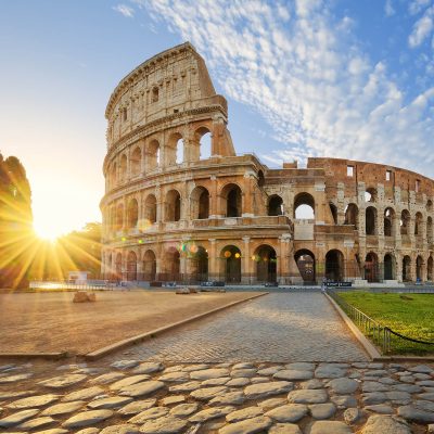 View of Colosseum in Rome and morning sun, Italy, Europe.